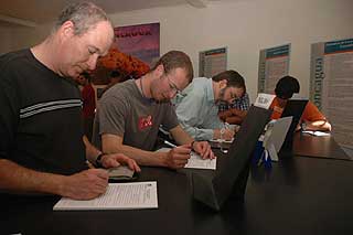 The team completes forms for their permits