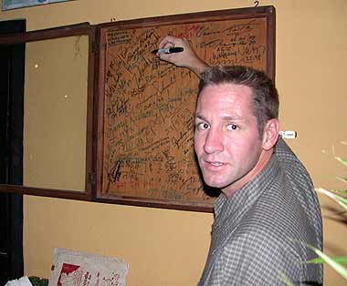 Brent Bishop signing next to his father at the Rum Doodle in Kathmandu