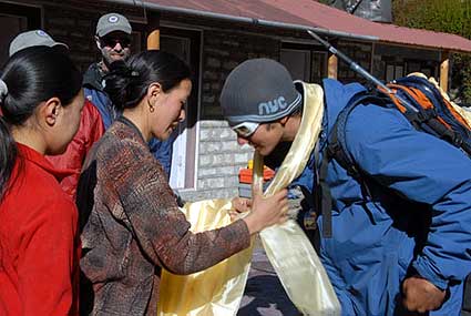 Yangzing gives Cam a Khata and says goodbye
