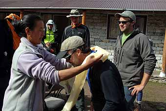 Jim Haskins receives a kata from Yanzing in Pangboche