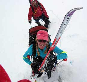 Maegan hands her skis up a steep section of the Khumbu icefall