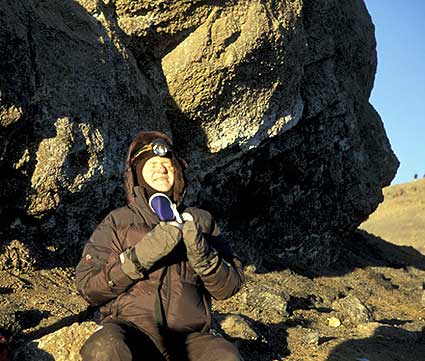 Image of Doc on a very emotional moment when he first summited Kilimanjaro with BAI on July 14, 2002