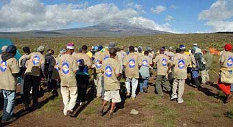 BAI staff welcoming the team as they arrive at each camp site with dancing and chanting