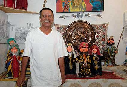Master puppet maker, Iskandar Khakimov shows off one of his masterpieces