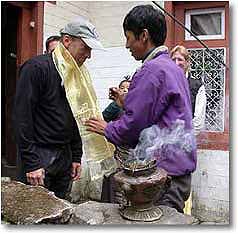 Climber receiving blessing in preparation for Ama Dablam