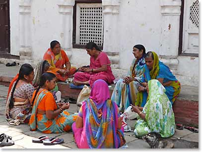 Local women passing time on the streets of Kathmandu