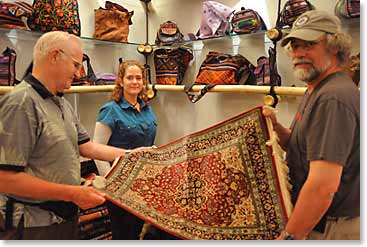 >Doc, Caroline and Dennis shopping at a handicrafts store in Thimpu