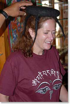 Caroline tries on a new Yak Hair hat at a shop along the road