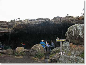 Ian and Michelle eating a meal in a cave