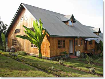 David is enjoying his stay at the Snow Cap Cottages located at the beginning of the Rongai route. The atmosphere at the Cottages is astounding with views of Kilimanjaro right outside the front door.