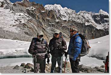Leland and Michael get prepared for cooler temperatures on top of Lobuche