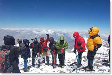 The team celebrates their climb at the top of Aconcagua