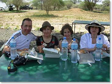 The Kochuks causiously eat their lunch as they watch for monkeys trying to steal their food