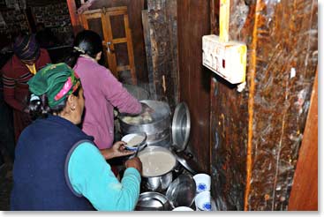 .A group of local Sherpa women get together to prepare a meal for the monks