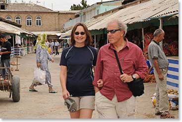 Vera and Charles walk in a local market in Pendjikent, Tajikistan