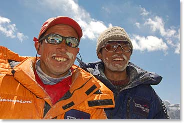 At the closing of the pooja ceremony, Tsampa flour is spread on the faces of team members and guests for blessing and good fortune. Climbing Sherpas Pemba Dorjee and Nwang are blessed at the pooja ceremony.