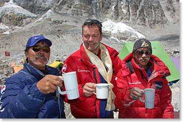 Temba, Jamie and Kami share a toast at the end of pooja.