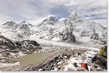 The panaroma from the top. Mount Everest is the dark triangle in the rear with a cloud on top.