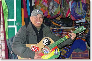  James trying out a local guitar.  He was surprised how in tune it was.