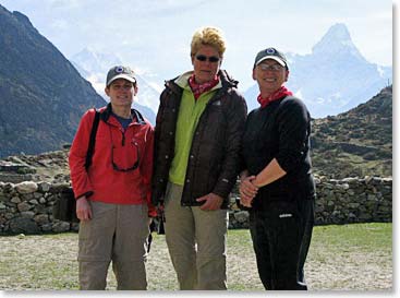 The girls pose with Ama Dablam behind.