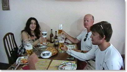 Our cook, Tamara, celebrates summit success with Jack and Scott.