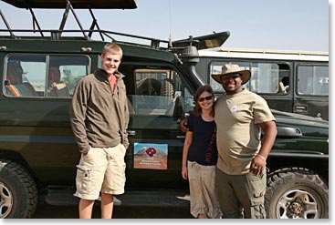 Francis, Brennen and Katherine pose in front of their Land Cruiser.