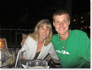 Mother and son enjoy a relaxing evening at the safari lodge.