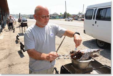 A few hours later we were out on the main road at our favorite place to stop for refreshments. With a surgeon’s skilled hands Chet inspects the cuts of lamb on the grill.