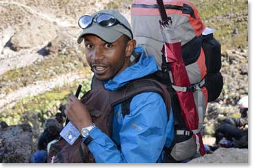 BAI guide Emmanuel in position on the lower section of the wall.