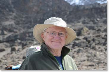 Doc with a satisfied smile.  He has returned to the mountain that he loves with his family.