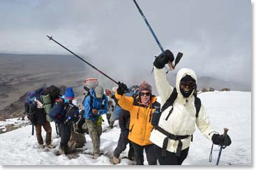 Rita and Holly with encouraging ‘ski poles up’ sign as they climb higher.