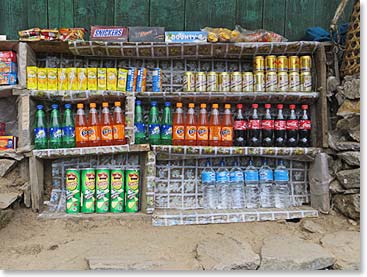 You can buy all the necessities along the trail.  Coke, Fanta, Red Bull, Snicker Bars, Potato Crisps and San Miguel Beer.