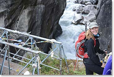 The Bhode Kosi river runs from the Nanpa La and the Tibetan border, past Thame.  We crossed our most spectacular bridge of the trip just before we arrived at Kami’s lodge.  It spanned a narrow gorge.  Tina was excited before she crossed the bridge.