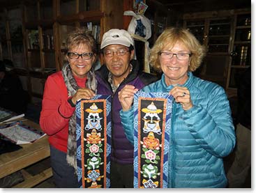 Sharon and Wendy each purchased one of Pasang’s paintings depicting Buddhist symbols for good luck and long life. 