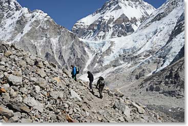 Temba, Liz and Fred on the trail to Gorak Shep. Just over their head is the Lho La, the pass into Tibet. Changtse, the north summit of Everest and entirely in China, stands behind.