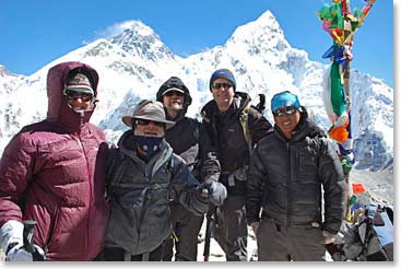The summit team on the top at 11:30 AM. It was very windy