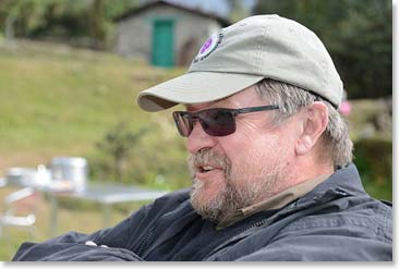 Our lodge was along the side of the airstrip.  Gerry took a seat to watch the aircraft coming and going.