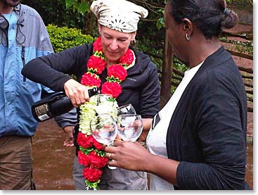 Patty pouring champagne for everyone