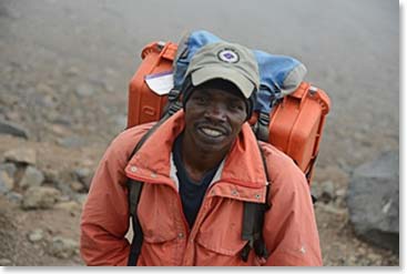 Besides being a Choirmaster, Arnold walks with us each day carrying our medical box.