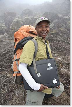 Cyprian carried the computer over.