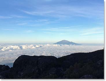 We awoke to the classic view of a floor of clouds over the forest reaching across to Mt. Meru.