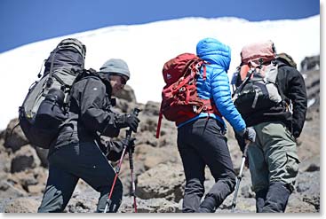 Dick and Terri follow chief guide Emmanuel toward the glaciers near Stella Point.