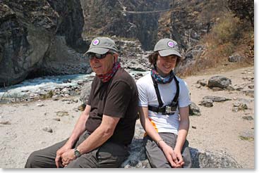 Grandfather Jim and grandson Jackson stop for a rest just before Namche