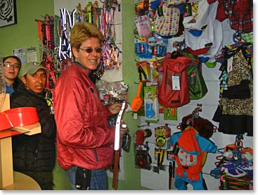 Chris looks at a dog collar for one of her many dogs! It is very fitting she would visit a pet store during her “Climb for Paws”