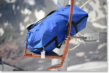 Our big bags ride up alone on a chair