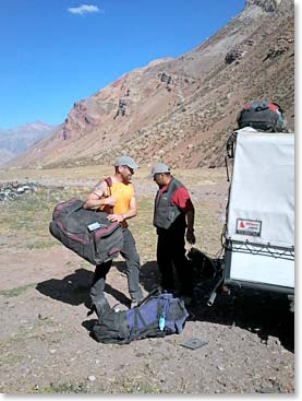 Trevor loads his bags.