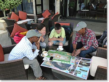 Arnold, Barbra, William and Herman go over maps of the climb. 