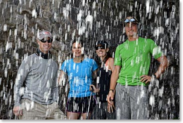 The team walked behind the waterfall to cool down from strong midday sun