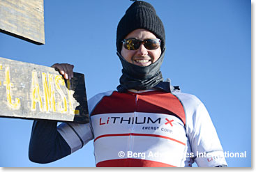 Brian Paes-Braga, CEO of Lithium X, proudly wearing the shirt on the summit of Kilimanjaro 