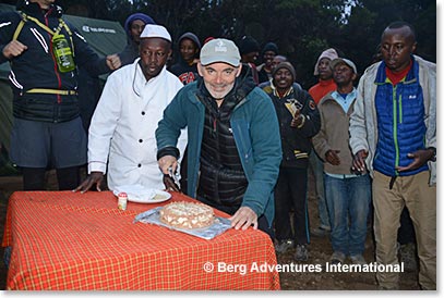 Frank Giustra slices the cake of the team.  Congratulations!